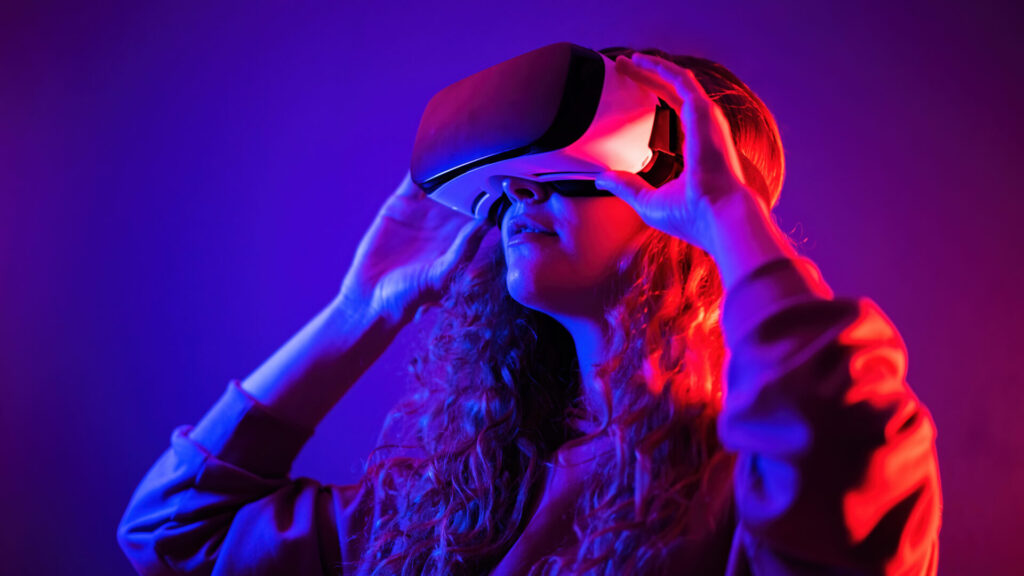 Young girl in virtual reality glasses at home